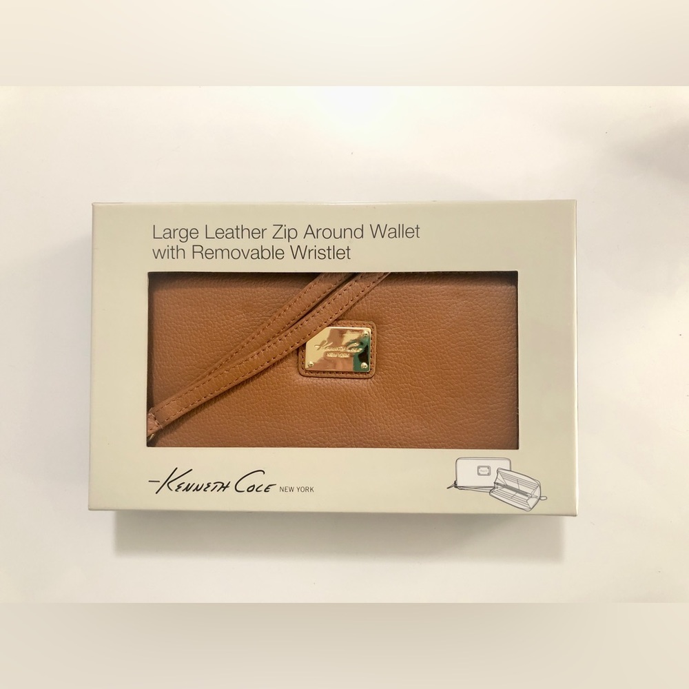 Kenneth Cole 
Large tan leather zip around wallet with removable wristlet.